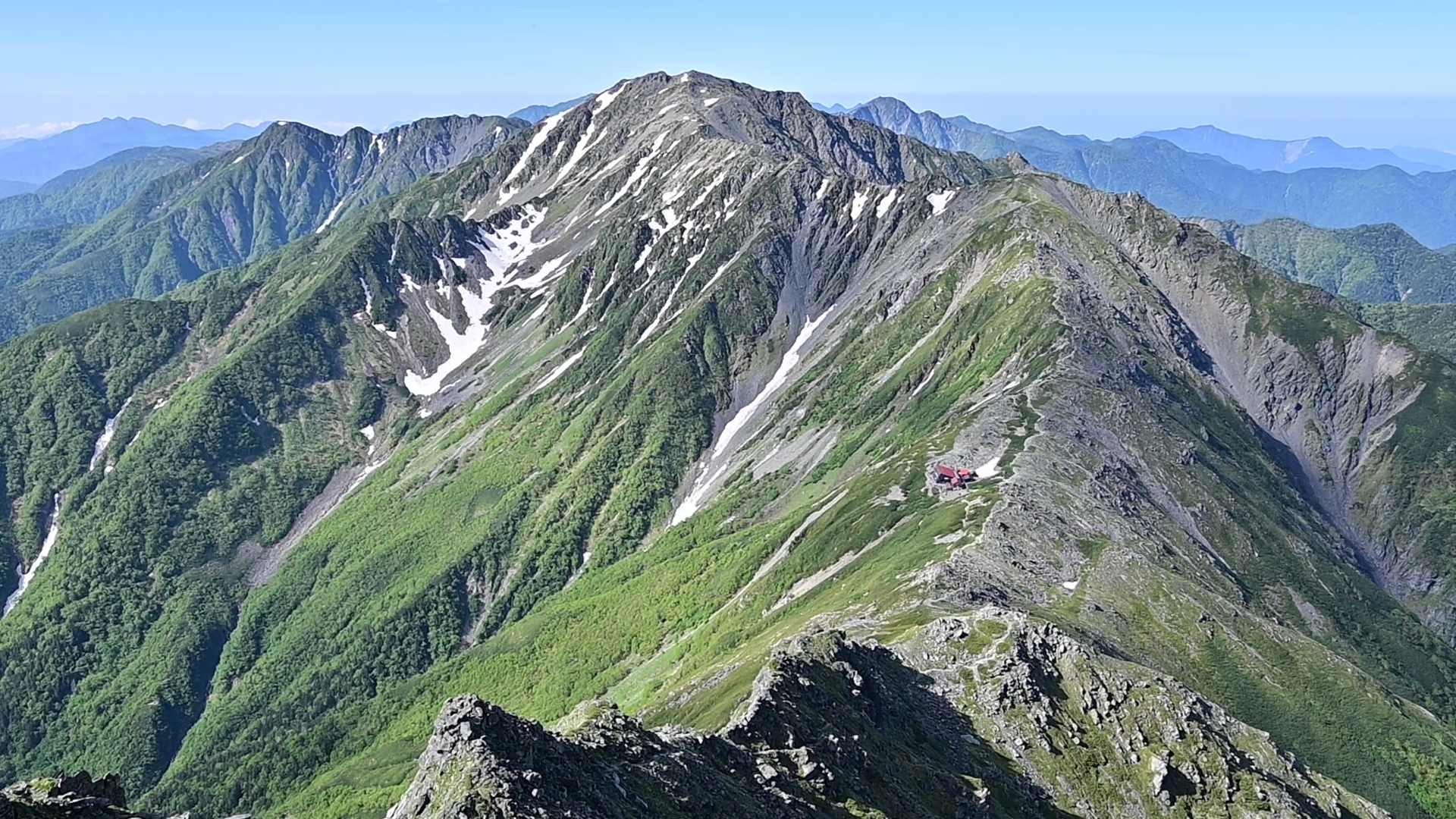 From the summit of Mt. Kitadake, you can see Mt. Fuji—Japan’s tallest peak—and Mt. Ainodake, the third highest, standing just beside it.<br />
<br />
The Southern Alps (Minami-Alps) lie at the heart of Japan’s central mountain system, surrounded by iconic ranges such as the Northern Alps (Kita-Alps), Central Alps (Chūō-Alps), Yatsugatake, and Chichibu. I would say this route offers the most panoramic alpine trail in Japan.<br />
<br />
Do keep in mind that summer afternoons often bring cloud cover or fog, due to the high humidity typical of Japan’s summer season. To ensure safety and enjoy clearer views, it’s best to start your hike very early in the morning and aim to finish by early afternoon. 01